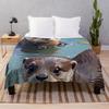 Swimming Otters In A Pond Throw Blanket