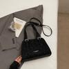 Korean version of high-value niche shoulder bag 2025 autumn new solid color fashion trend glossy underarm handbag women