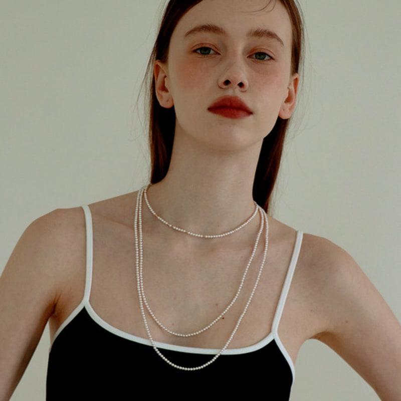 Less is more long pearl necklace