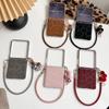 Leopard Print Leather Texture Samsung Z Flip7 Case with Anti-lost Fluffy Ball Pendant and Wrist Strap