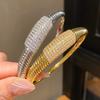 Elegant Striped Oval Bangle Bracelet With Gold Plating For Fashionable Women