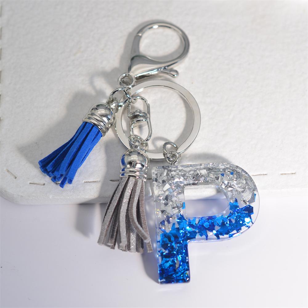 Креативные брелки из смолы с 26 буквами и кисточками — фото 22