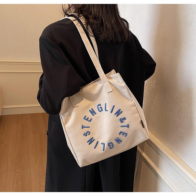 Literary letter canvas bag women's large capacity 2025 new simple shoulder college student tote bag