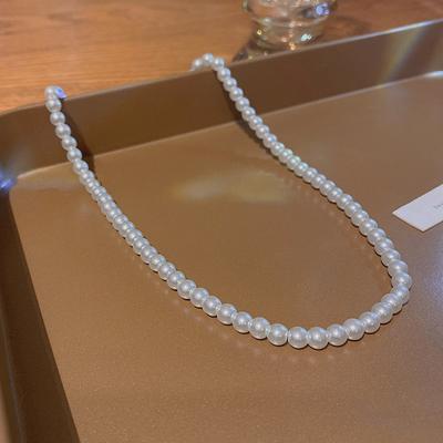 Collier de perles classique rétro européen et américain pour femmes, chaîne de clavicule perlée haut de gamme, style Hong Kong