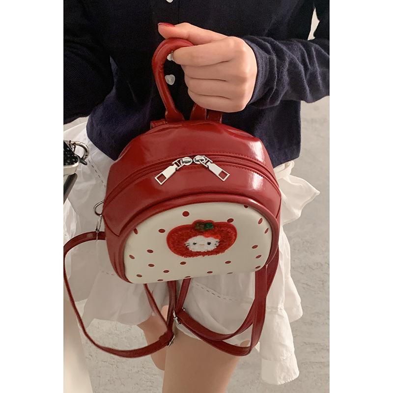 

Korean version of fashion polka dot handbag women s 2025 spring new cartoon cat casual versatile backpack красный