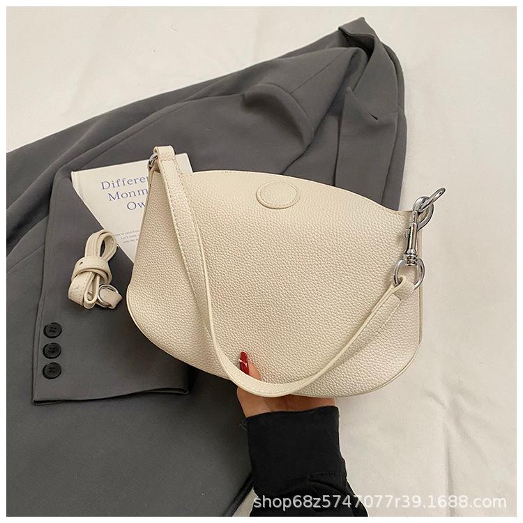 Niche design dumpling armpit bag 2025 summer new shoulder messenger bag high-end versatile lychee pattern saddle bag