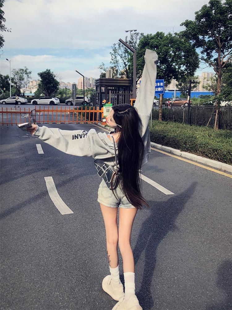 American-Style Oversized Off-Shoulder Sweater: Letter Print, Long Sleeve, Casual Loose Fit for Women In Early Autumn.
