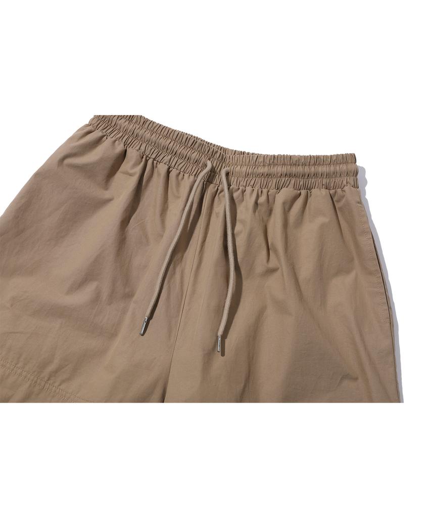 CPGN STUDIO Weite Cargohosen Beige