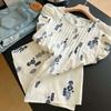 Damen weiße Bluse mit blauem Blumenprint Rüschen-Kappärmeln Faltenfront Lässiges lockeres Oberteil