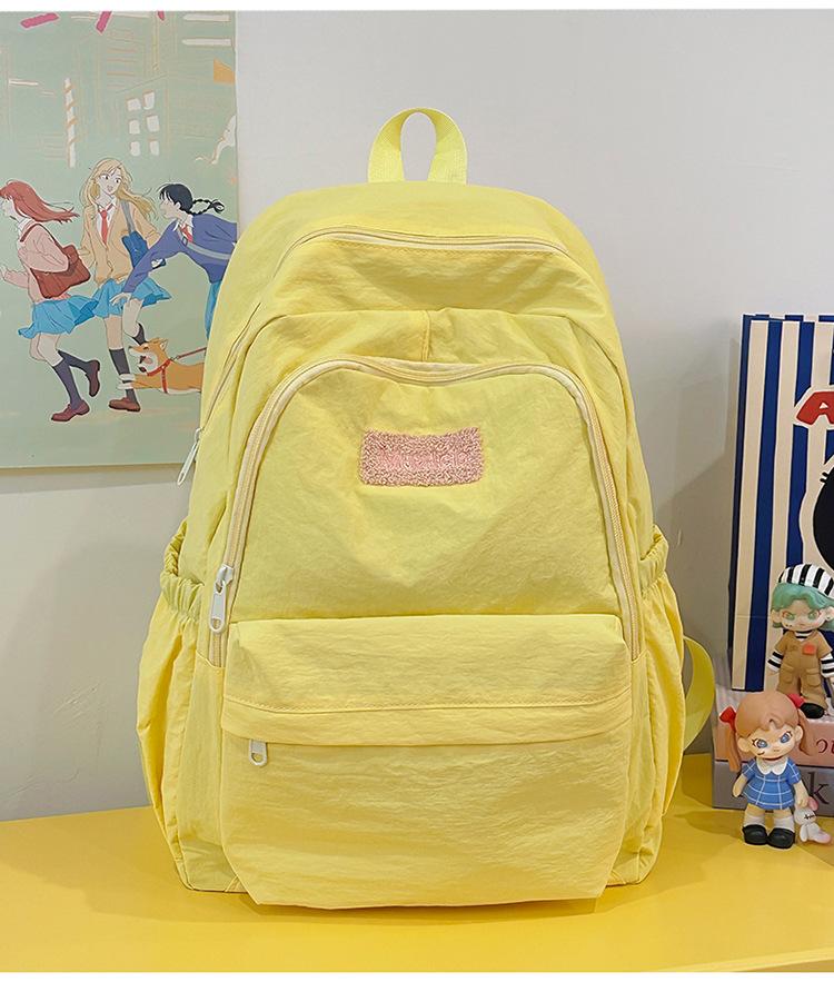School bag 2025 new large-capacity sweet and cute college student school bag Korean version fresh and versatile backpack casual and lightweight bag