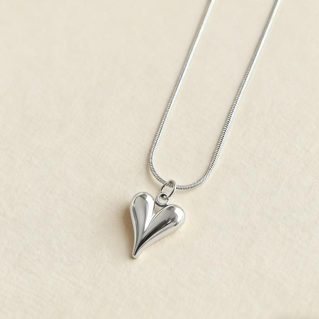 Elegant Double-Layer Heart Pendant Necklace: European & American Design, Fashionable Clavicle and Snake Chain for Women