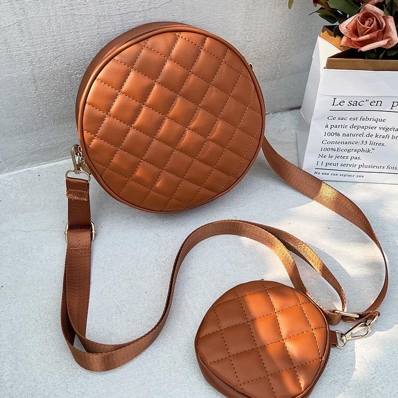 Bag women's new solid color rhombus embroidered messenger small round bag with change small bag fashionable one