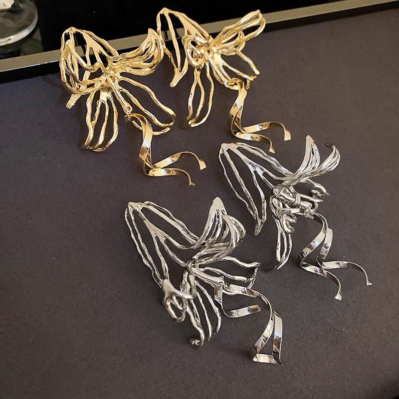 Elegant Metallic Hollow Flower Stud Earrings - European and American Fashion Statement for Women