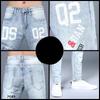 Men's Slim Light Blue European-Style Skinny Jeans with Korean Print, Perfect for Spring and Autumn.