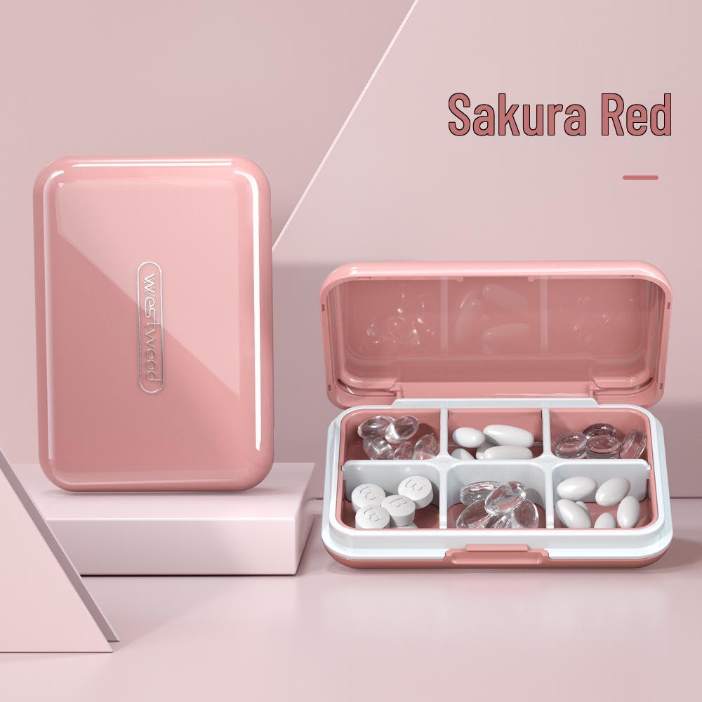 Compact 4-Compartment Japan Pill Box: Portable, Sealed, 7-Day Organizer