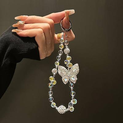 Bracelet de luxe avec pendentif papillon en cristal laser et diamants pour iPhone, sac, clé, accessoires pour téléphone portable, porte-clés, bracelet suspendu