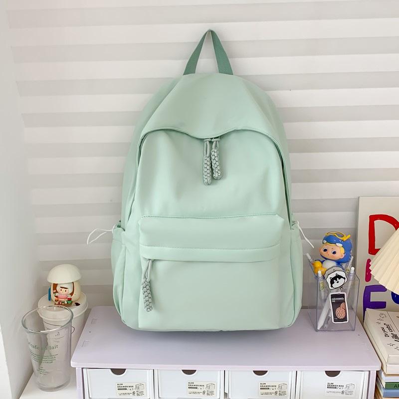 Schoolbag simple solid color schoolbag female Japanese large-capacity backpack junior high school student college student lightweight backpack 
