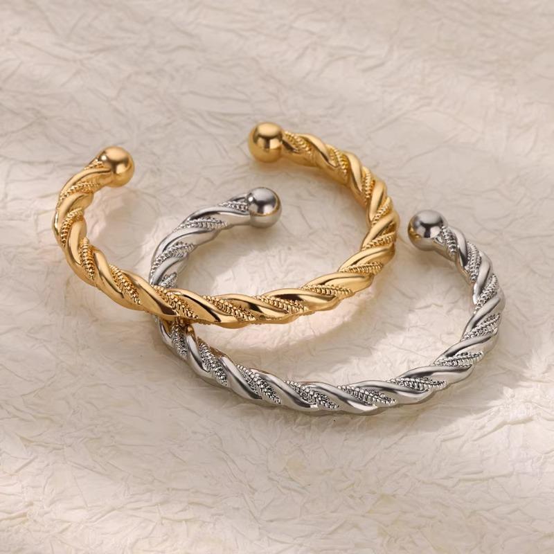 Hot-selling stainless steel bracelet woven twist steel wire open bracelet individual cold titanium steel color-retaining jewelry