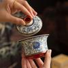 Blue and White Porcelain Lotus Kung Fu Tea Set: Enamel Teacup, Hovering Lid, Teapot, Saucer, and Master Cup.