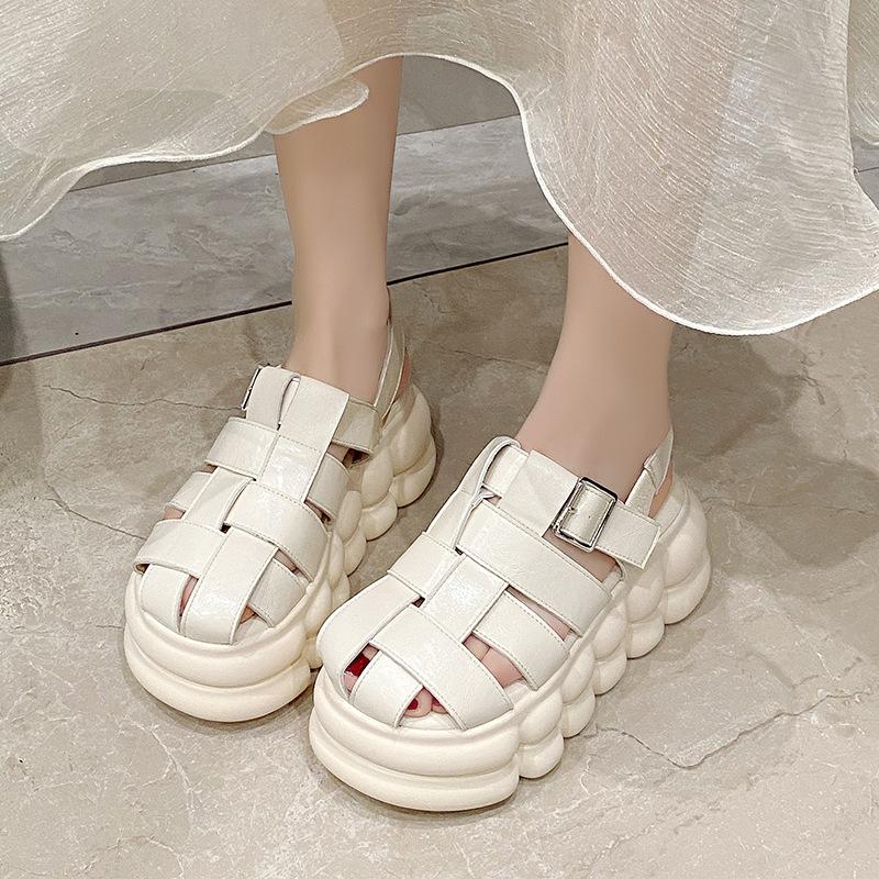 

Soft leather bag head woven slippers women s summer wear 2025 new retro soft bottom height increased by 8 cm hollow cool slippers 39