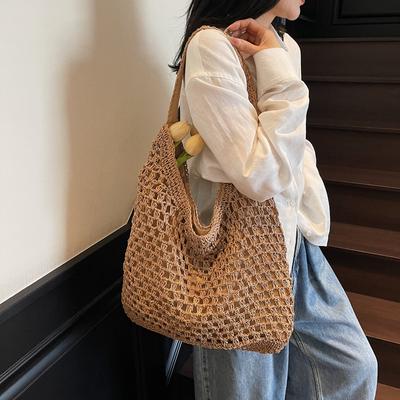 Gewebte Strohtasche Damen große Kapazität neue Frühjahrs- und Sommer-Hohl-Schulter-Tragetasche Lazy-Stil Strandtasche
