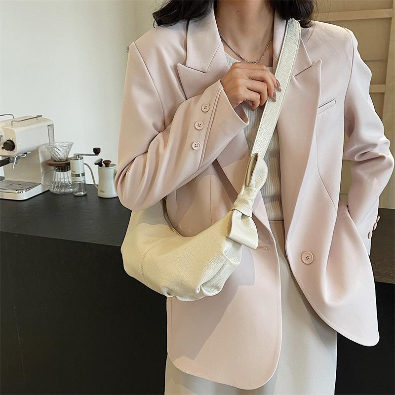This year, the popular small bag women's 2025 spring new messenger bag high-end texture versatile single shoulder crescent dumpling bag
