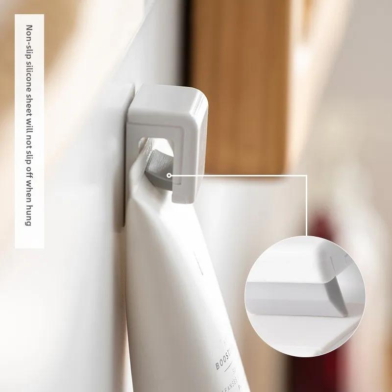 Toothpaste Holder Wall Mounted Self-adhesive Hanging Rack Face Cleanser Storage Rack Organizer Bathroom Accessories