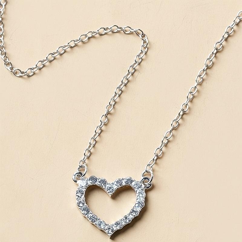 A Pendant Necklace for Women with a Rhinestone-embellished Hollow Heart Design for Valentine's Day