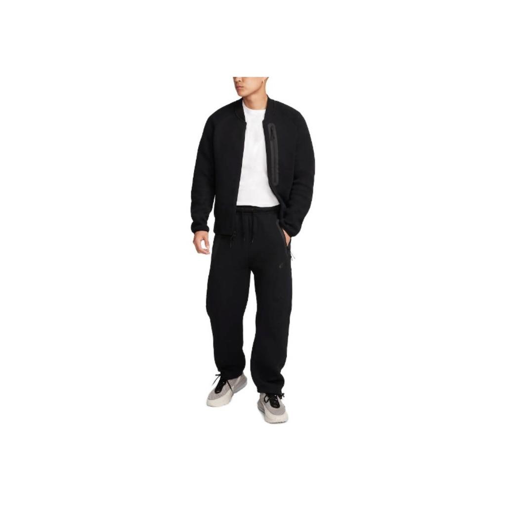 Nike Pánské pletené tepláky se stahovací šňůrkou, volného střihu s polovičním pasem, černé FB8013-010