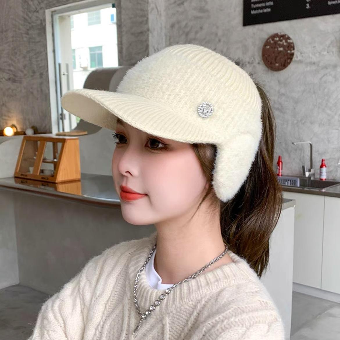 

Winter new women s ear protection warm cap empty top tie ponytail M standard wool hat cycling cold-proof knitted hat Fleece has high elasticity.