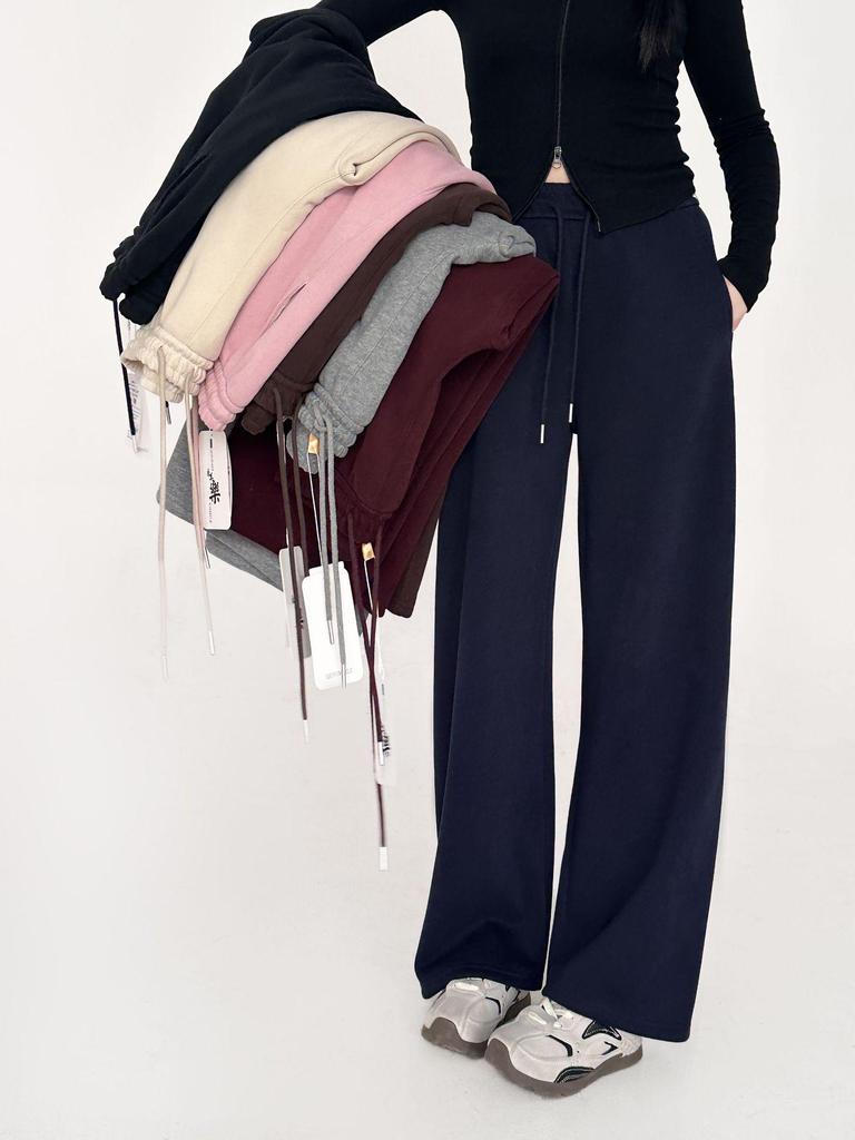 Dámské zimní ležérní tepláky s širokými nohavicemi a středním pasem, zdobené nýty