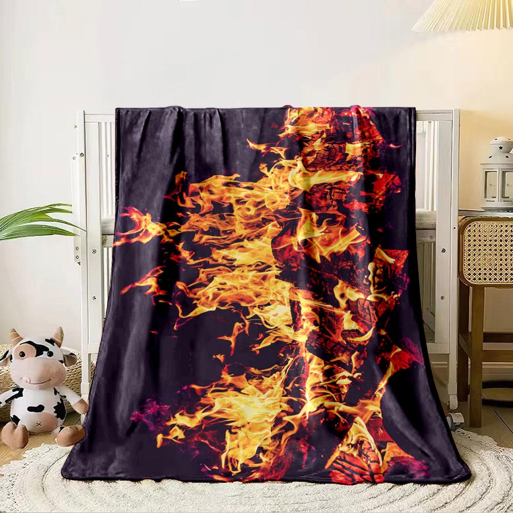 Yellow and orange flames engulfing burning wood against a dark background. for all seasons blanket lunch break throw gift 80cm x 120cm