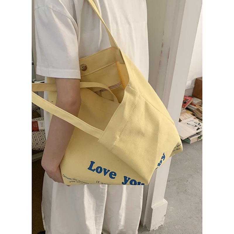 

Korean version of casual large-capacity underarm bag women s 2025 new letter print tote bag shoulder shopping bag жёлтый