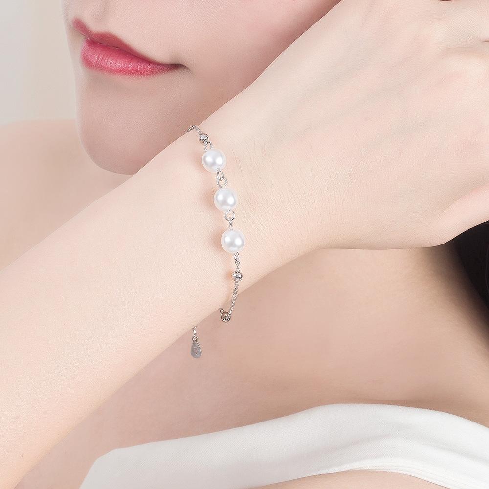 Versioni giapponesi e coreane di braccialetti a croce di perle rotonde semplici placcati in argento, braccialetti all'ingrosso, braccialetti di perle temperamentali