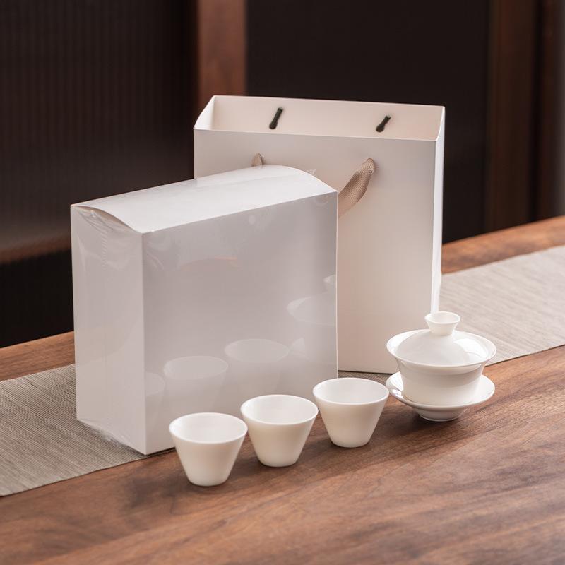 

Light luxury suet jade porcelain kung fu tea set, high-end three talents cover bowl teacup business souvenir gift box hardcover