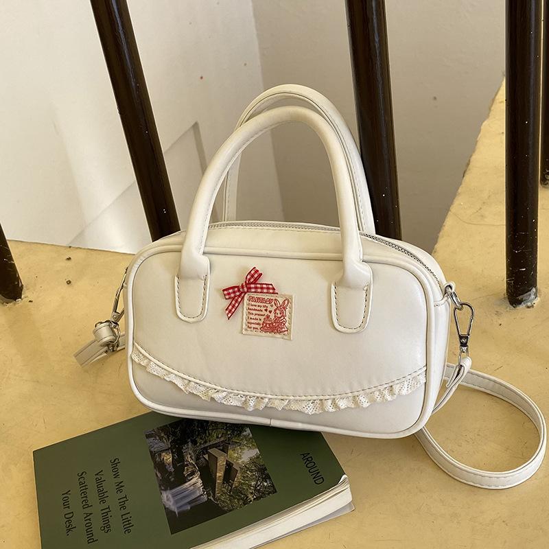 Korean ins hand-held bowling bag women's 2025 spring new fashion shoulder oblique span bag high-end small square bag