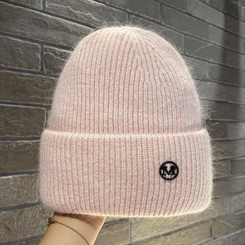 Herbst und Winter Neue Metallbuchstabe M Standard Strickwollmütze Warmer Ohrenschützer Kopf Kälteschutzmütze