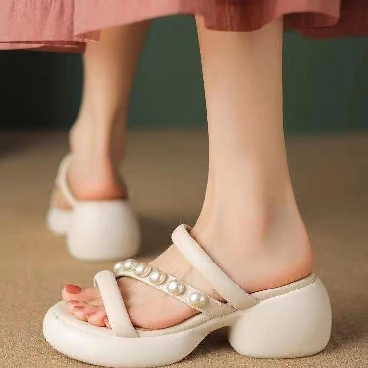 

Korean version wears thick-soled Roman lightweight one-word drag pearl cool slippers thick heel muffin bottom open-toed women s sandals 40
