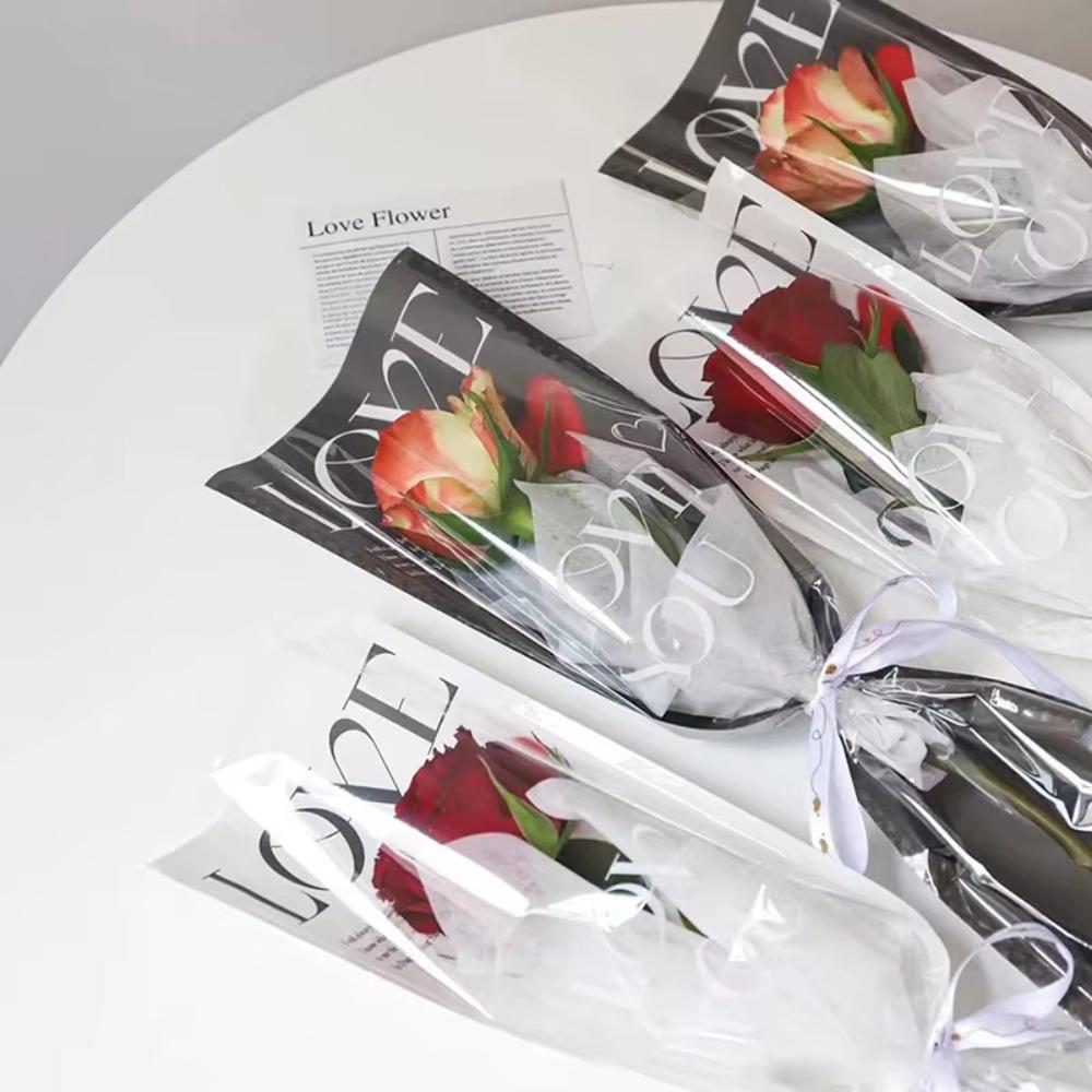 Wasserdichte Bouquet-Plastiktüte LOVE Blumen-Geschenkpapier Neue Rosenverpackungsbeutel
