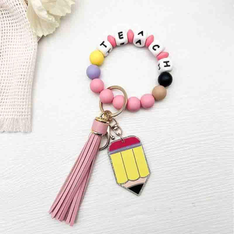 Silicone Bead & Wood Tassel Bracelet Keychain with Cartoon Acrylic Pendant розовый