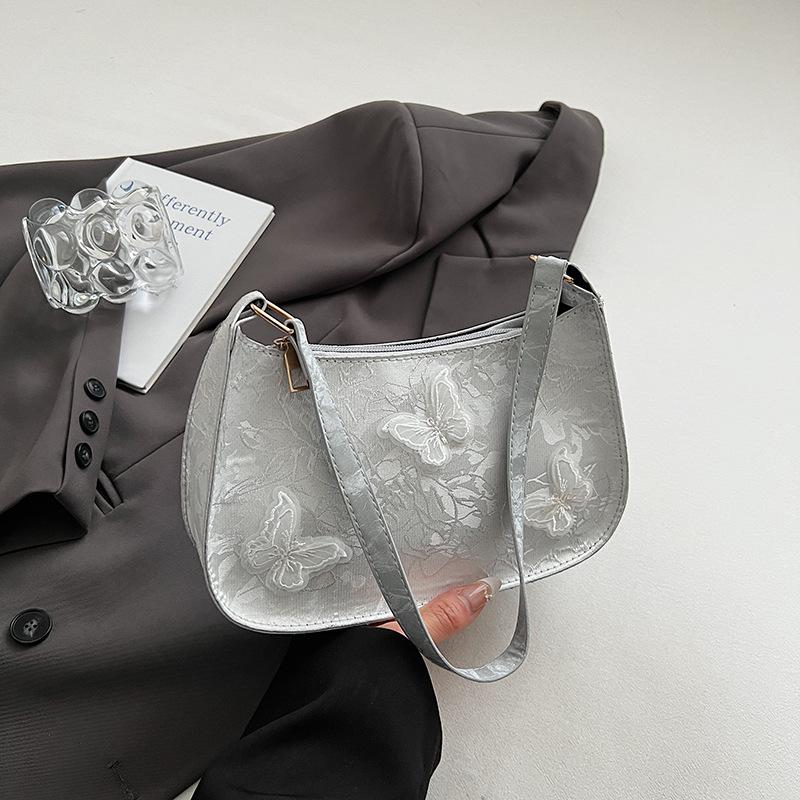 

Summer new beautiful casual butterfly sweet shoulder armpit bag lightweight versatile simple hand bag срібний