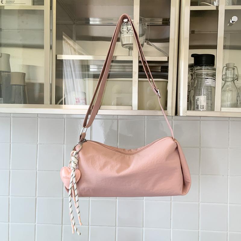 

Korean version of casual nylon bag women s 2025 new niche design messenger bag small fresh and cute commuter armpit bag 29*10*13