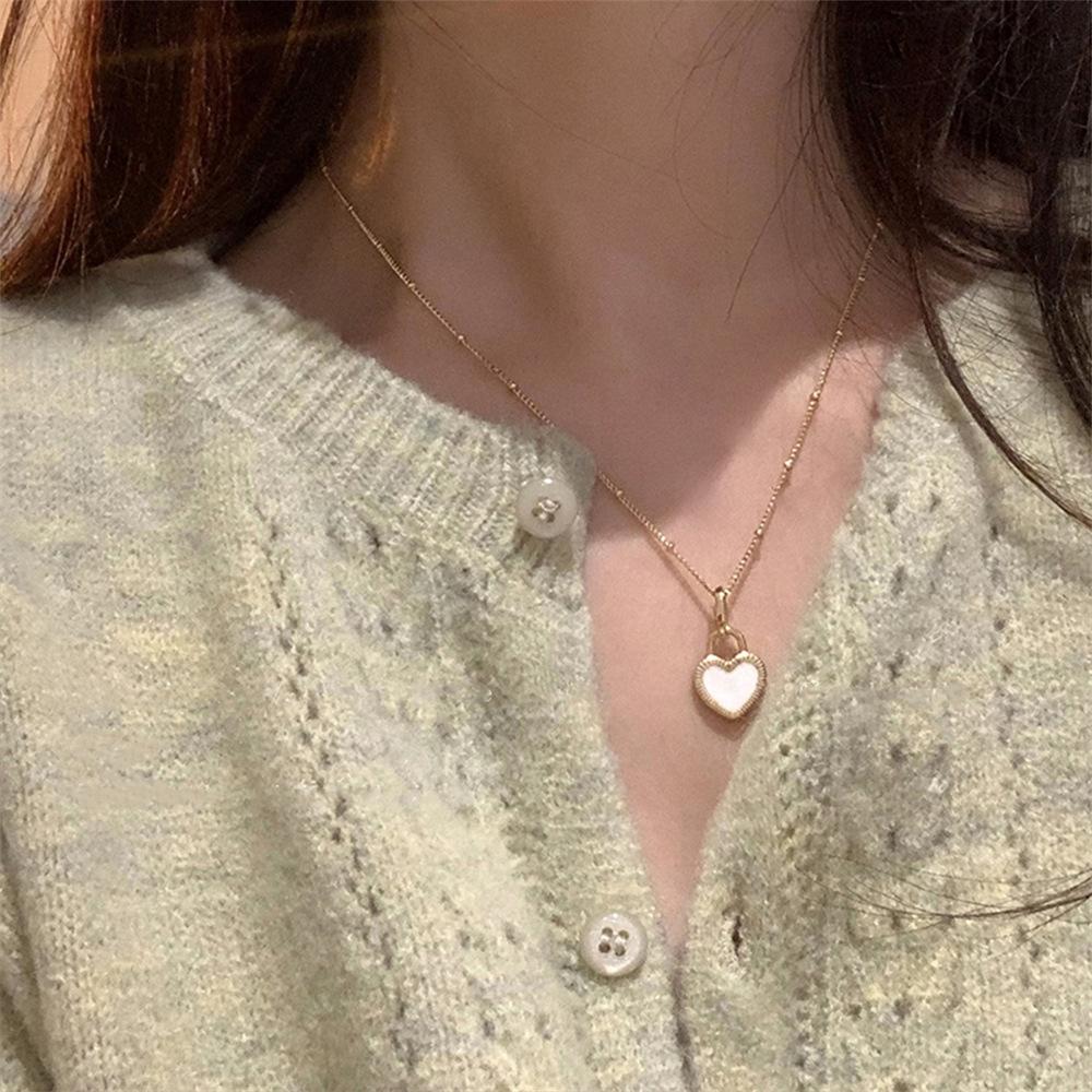 Black and white double-sided drip glaze love necklace 2025 trendy light luxury niche peach heart sweater chain accessories