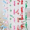 Christmas Decorations: Hanging Ornaments, Balls, Candy Canes, and String Arrangements for Windows.