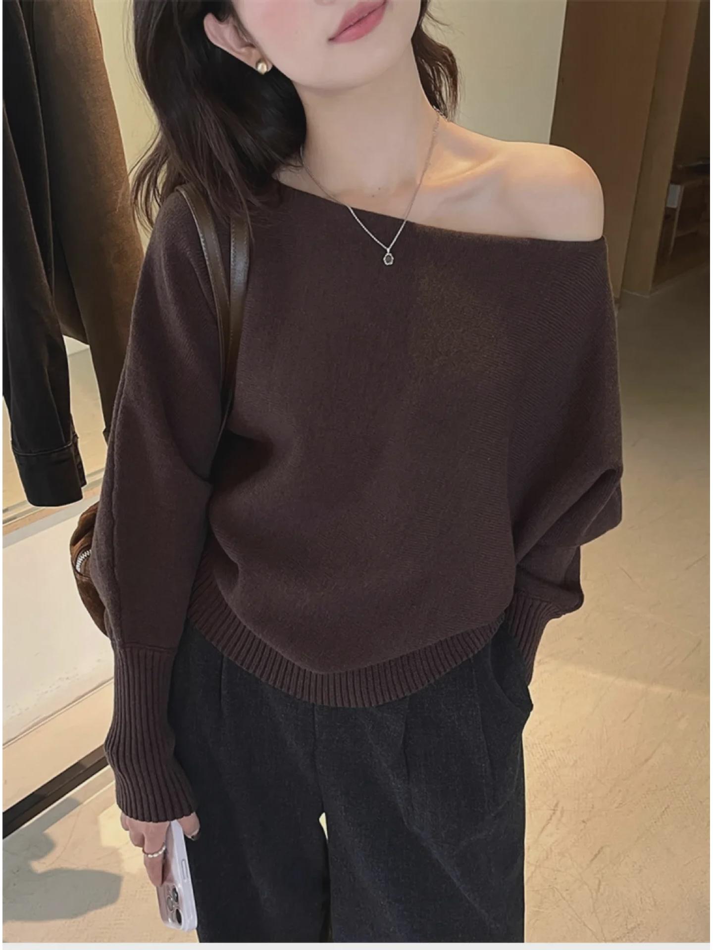 

Женский вязаный свитер с косой вязкой - серый, весна 2025 Medium