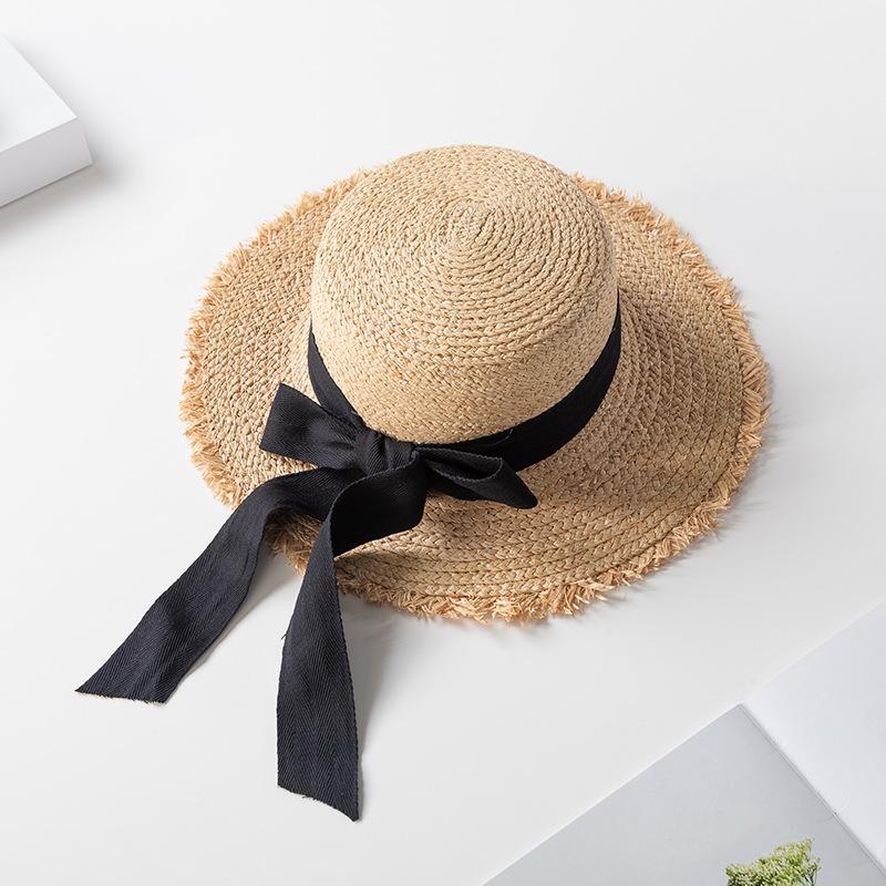 Korean version of elegant flat-top raffia straw hat for women's summer small fresh bow holiday beach big-brimmed sun hat