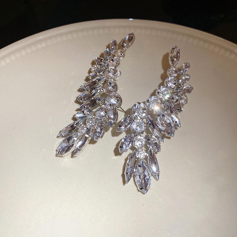 

Silver Needle Diamond Round Rice Grain Pendant Earrings Exquisite Fashion Earrings Light Luxury Premium Earrings Design Niche