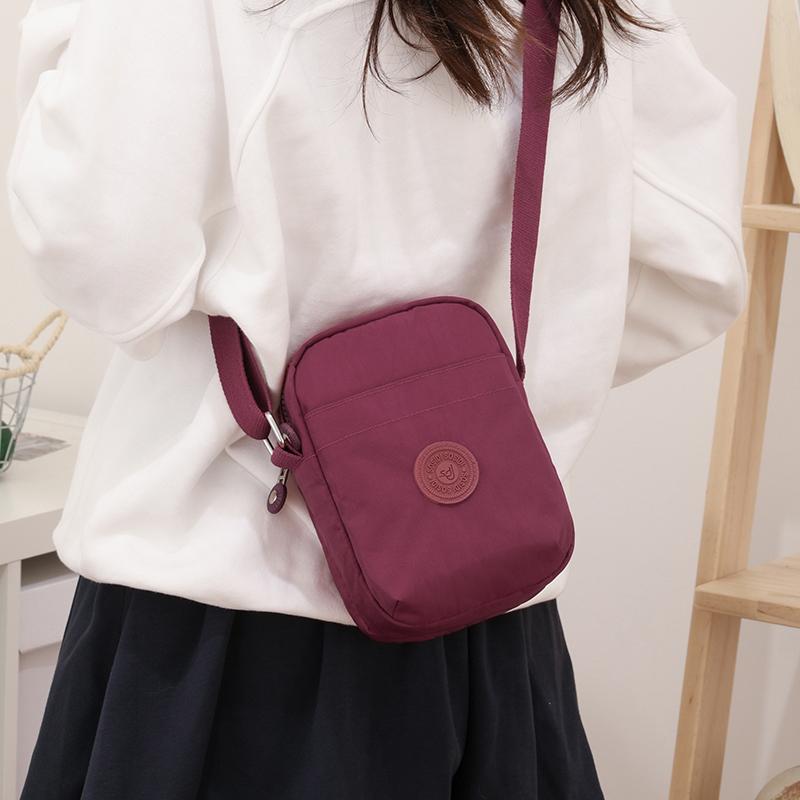 Compact Nylon Crossbody Bag with Double Zipper Closure Adjustable Strap Small Casual Purse for Daily Travel