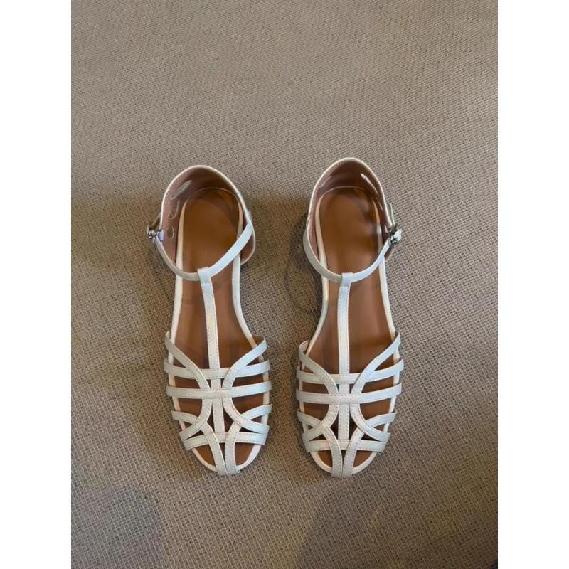 

Woven retro hollow breathable sandals women s 2025 summer new flat-bottomed casual versatile one-word buckle strap Roman shoes 42 бежевый