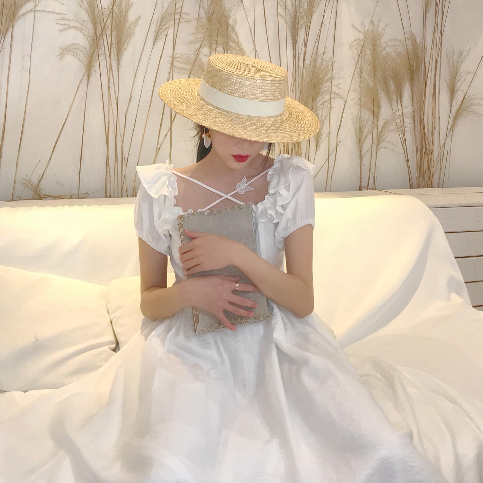 

Women s flat-top summer straw hat, vacation wheat straw woven seaside beach hat, internet celebrity sun protection British-style fedora Adjustable